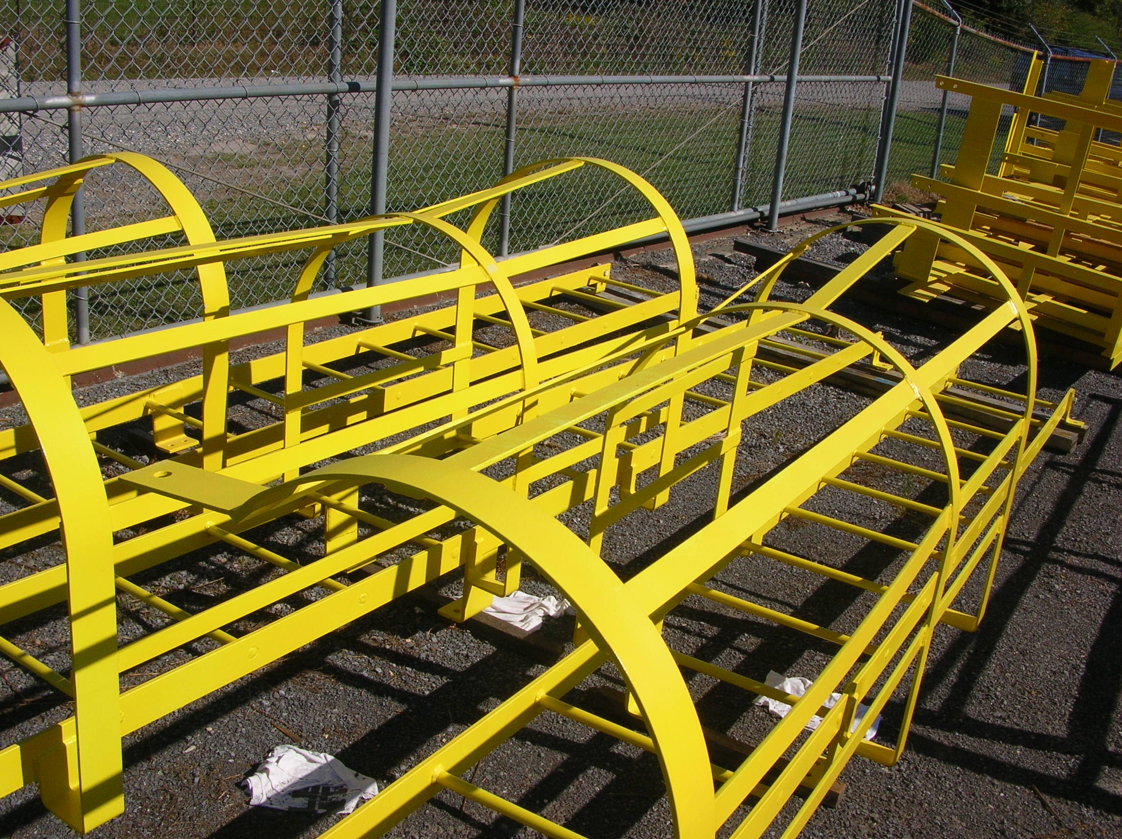 Simplified OSHA rules for fixed ladders apply to ladders like these caged ladders